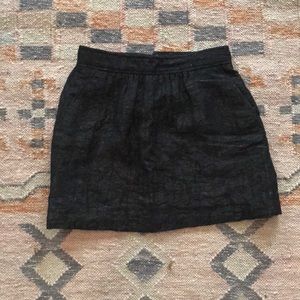 Tibi Mini black skirt with slight metallic color